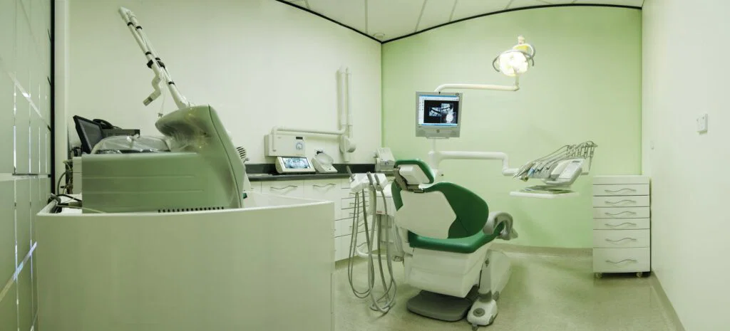 Treatment room with dental chair and X-ray equipment